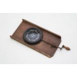 An antique chromatrope magic lantern slide with rotating element, 17cm long.