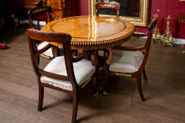 Wooden 1800's eagle themed table with 4 associated cream reupholstered chairs