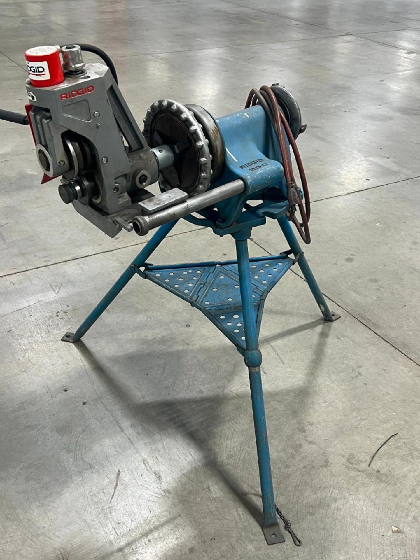 Ridgid 300 pipe threading machine on tri-stand.