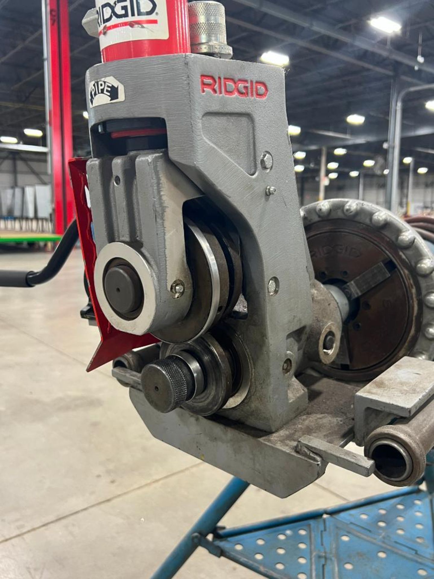 Tri Color Threading Machine Ridgid 300 pipe threading machine on tri-stand.