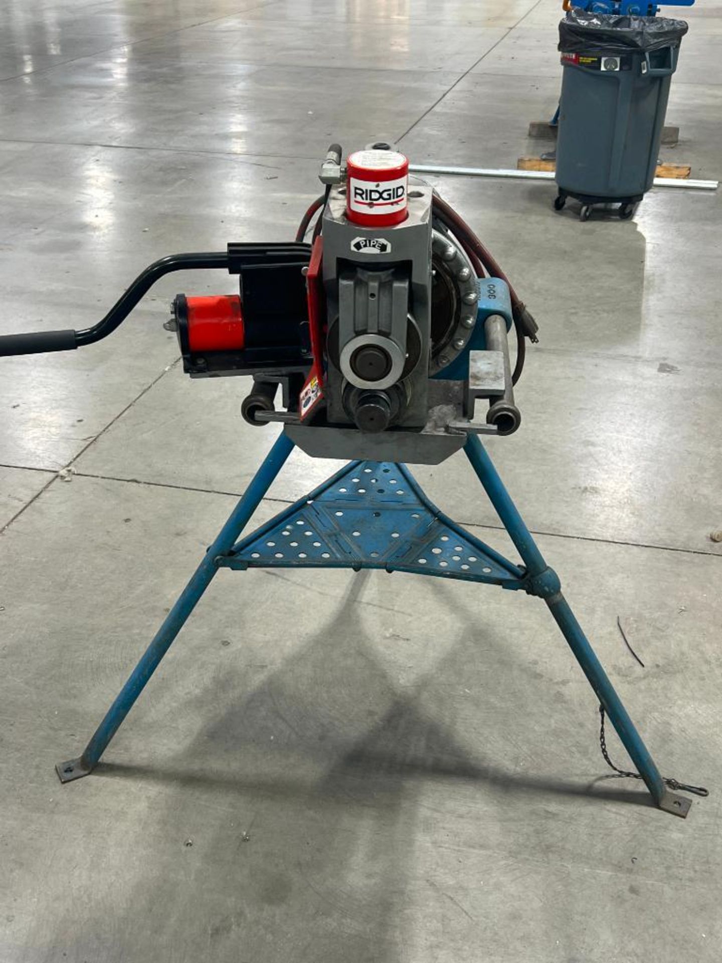 Tri Color Threading Machine Ridgid 300 pipe threading machine on tri-stand.