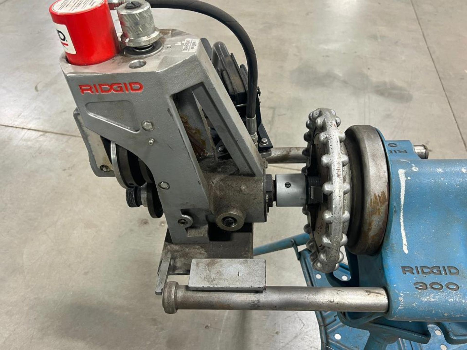 Tri Color Threading Machine Ridgid 300 pipe threading machine on tri-stand.