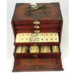 Mahjong. A cased bamboo and bone mahjong set