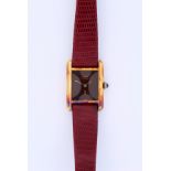 Cartier, Must de Cartier Tank, vermeil, case no. 3-072381, circa 1980s. The wood dial, signed with