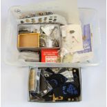 Large clear crate with a very mixed range of Cap badges, a vast amount of Military Buttons, Cloth,