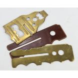 Militaria: Three diverse uniform protectors, comprising a brass equipment protector, impressed to