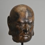 A CHINESE CARVED GREY LIMESTONE HEAD OF LUOHAN, SONG TO MING DYNASTY.