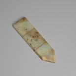 A CHINESE ARCHAISTIC PALE CELADON JADE 'TAOTIE MASK' BLADE, GUI, MING DYNASTY.