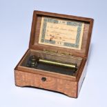 Swiss music box in root wood with an original paper title card indicating 3 waltzes and handwritten