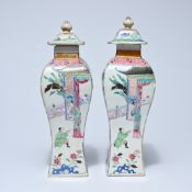 Pair of Chinese famille rose lidded vases, enamelled decoration of garden scenes, 19th century