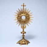 Richly decorated neo-Gothic ecclesiastical monstrance in gilded metal, with a central theca surround