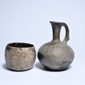 A jug with handle and a cup in gray earthenware, with simple decorations, Persia Amlash, Bronze Age