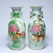A pair of Chinese famille rose vases with deer and peonies in a landscape, 20th century