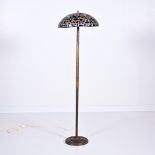 Stained glass mosaic lamp on a tall brass stand, circa 1910, French
