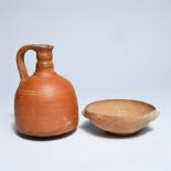 A Roman terracotta jug and bowl