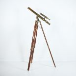 Extendable Telescope mounted on a wooden tripod with adjustable legs, 20th Century