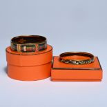 2 Hermès vintage enamel bracelets with original orange gift boxes, marked