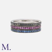 THEO FENNELL, A Set of Stacking Rings in 18 carat white gold, one set with round cut black diamonds,