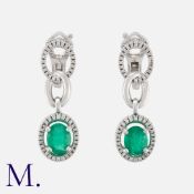 MAUBOUSSIN, A Pair of Emerald and Diamond Earrings in 18 carat white gold, each designed as a series