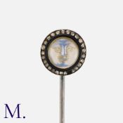 An Antique Man in the Moon Pin & Box with carved moonstone in a smiling man in the moon with rose