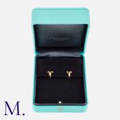 Tiffany & Co. A Pair of 'T:T1' Hoop Earrings in 18 carat yellow gold, each comprising the capital
