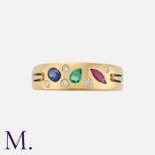 A Gemset and Diamond Ring in 18 carat yellow and white gold, set with round cut diamonds and a ruby,