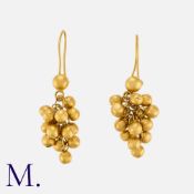 A Pair of Gold Drop Earrings with articulated ball drops. Indistinct marks; tests indicate 22k gold.