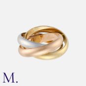 CARTIER. A Trinity Ring in 18K yellow, rose and white gold, signed Cartier and serial numbered.