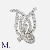 A Diamond Brooch in 18 carat white gold and platinum, Set with round brilliant and baguette cut