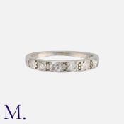 A Diamond Band, in platinum, set with a row of six round cut diamonds. Marked indistinctly PT. Size: