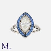 A Diamond and Sapphire Ring in platinum, set with a marquise cut diamond weighing approx. 1.6ct,