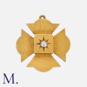 A Maltese Cross Brooch Pendant in yellow gold, set with a central old cut diamond of approximately