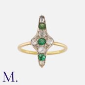An Emerald and Diamond Ring in yellow gold, the navette form set with old cut diamonds totalling
