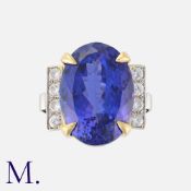 A Fine 24.90 Carat Tanzanite and Diamond Ring in yellow and white gold, set with a large Tanzanite