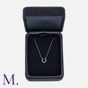 Tiffany & Co A Diamond Horseshoe Pendant Necklace in 18 carat white gold, comprising a diamond set