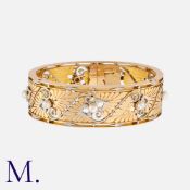 A Fine Antique French Pearl Bangle in yellow gold and platinum, the hinged bangle with repeated