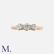 A Diamond 3-Stone Ring in yellow gold and platinum, set with three round cut diamonds weighing