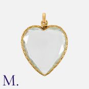 A Rock Crystal Heart Locket Pendant in yellow gold, comprising two faceted rock crystal heart shaped