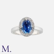 A 2.90 Carat Unheated Ceylon Sapphire and Diamond Ring in 18 carat white gold. set with a