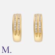 A Pair of Diamond Earrings in 18K yellow gold, set with two rows of round brilliant diamonds