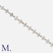 A Diamond Line Bracelet in 18 carat white gold, set with round brilliant cut diamonds totalling