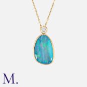 A Boulder Opal and Diamond Pendant Necklace in 18 carat yellow gold, the pendant set with a round
