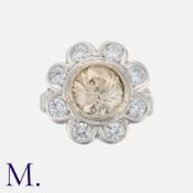 A 2.14 Carat Diamond Cluster Ring in 18 carat white gold and platinum, set with a principal coloured