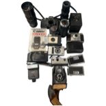 An Assortment of Vintage Cameras, Lenses, and Photographic Accessories Including Canon, Kodak