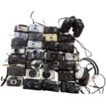 A Collection of Vintage 35mm Compact Cameras, Binoculars, and Headphones including Minolta, Kodak,