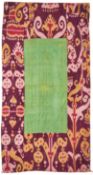 A SILK AND IKAT QUILTED PANEL, UZBEKISTAN, PROBABLY BOKHARA, CIRCA 1900