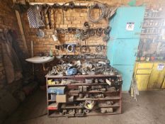 STEEL WORK BENCH WITH WALL-MOUNTED RACK & VARIOUS STEEL PARTS - STC