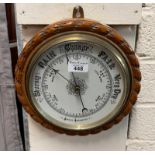 20th century aneroid barometer with pale oak rope twist frame. 27cm diameter approx. (B.P. 21% +