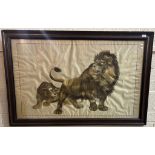 Large silk embroidered needlework panel depicting lion and lioness. 78x126cm approx. Framed and