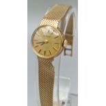 9ct gold Tudor (Rolex) ladies' bracelet wristwatch with satin face having Baton numerals, on gold